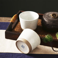 Elegant Beige Tea Cups with a Touch of Natural Brown