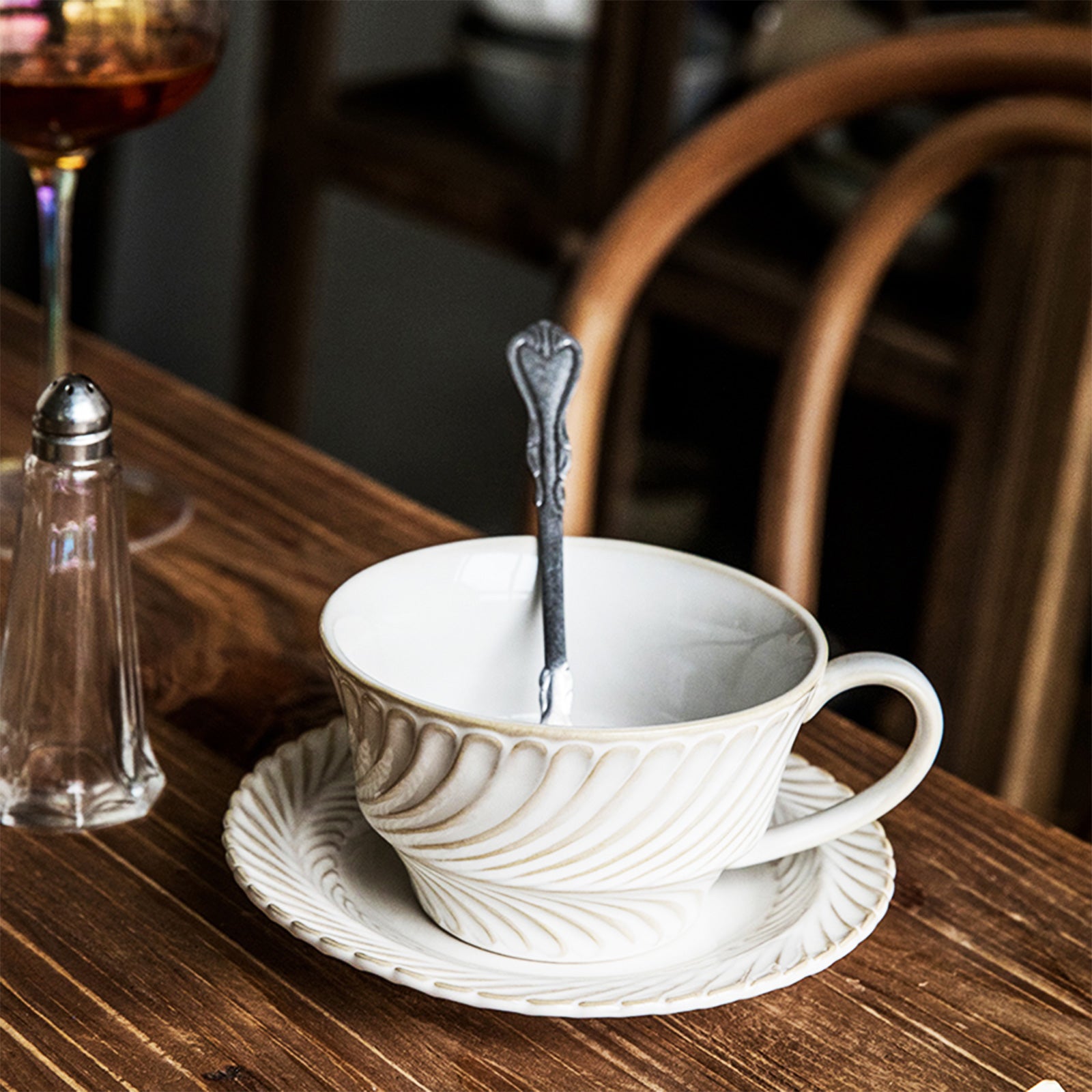 Elegant White and Cream Swirl-Pattern Coffee Cup with Matching Saucer