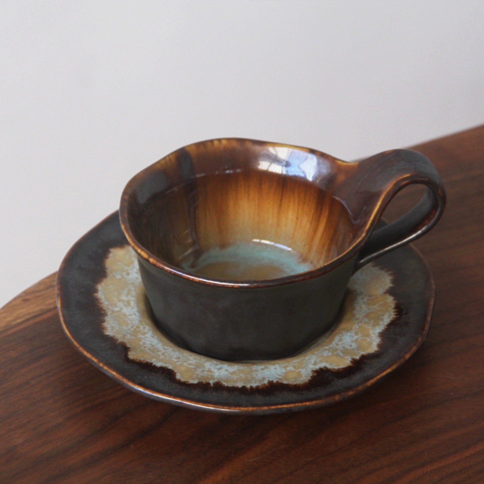 Sophisticated Ceramic Coffee Cups with Unique Glaze Designs and Matching Saucers-7